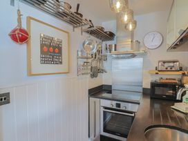 A kitchen with various appliances and utensils at Seaside in Lyme Regis