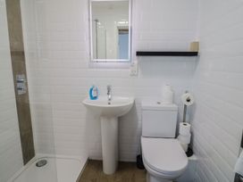 A bathroom with a sink and toilet at Seaside in Lyme Regis