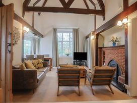 A living room with sofa and armchairs at Maries in Lyme Regis