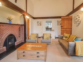 A living room with a sofa and armchairs at Maries Lyme Regis