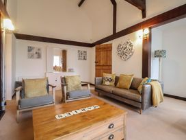 A living room featuring a sofa and armchairs at Maries in Lyme Regis