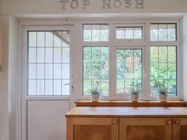 A kitchen with a window and a table at Maries in Lyme Regis