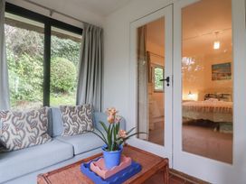 A snug with a sofa and a plant at Maries in Lyme Regis