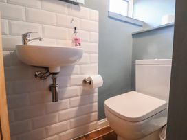 A bathroom with a sink and a toilet at Maries in Lyme Regis