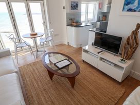 A living room with a view of the sea at Seagull in Lyme Regis