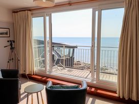 A living room with a view of the sea at Watersmeet in Lyme Regis