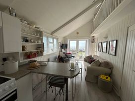 A living room with a couch and chairs at 8 Bowling Green Chalets Lyme Regis
