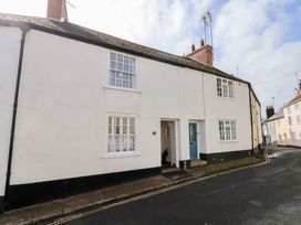 A house with a blue door and white walls at 3 Dolphin Cottages in Lyme Regis