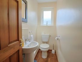 A bathroom with a sink and toilet at The Orchard Country House Rousdon