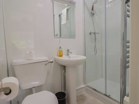 A bathroom with a shower and sink at The Orchard Country House Rousdon