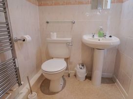 A bathroom with toilet and sink at The Orchard Country House Rousdon