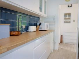 A kitchen with a countertop and appliances at High Trees Lyme Regis