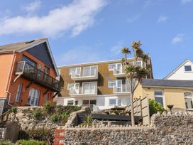 Two houses with balconies and plants at 1 Bay View Court in Lyme Regis