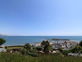 A view of the sea and marina with boats at Greystones Lyme Regis