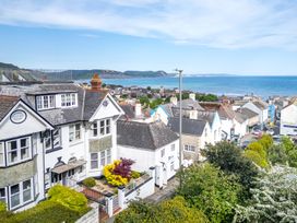 A view of houses and sea at 2 Hadleigh Villas in Lyme Regis