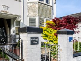 An entrance with a gate and plants at Hadleigh Villas in Lyme Regis