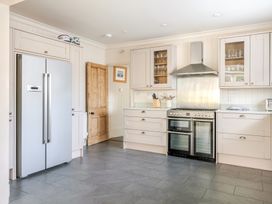 A kitchen with appliances and cabinets at 2 Hadleigh Villas in Lyme Regis