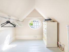 A dressing room with hangers and a dresser at 2 Hadleigh Villas Lyme Regis