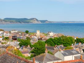 A view of houses and sea at 2 Hadleigh Villas in Lyme Regis