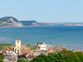 A view of coastal buildings and sea at 2 Hadleigh Villas Lyme Regis