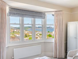 A bedroom with views of the landscape at 2 Hadleigh Villas Lyme Regis