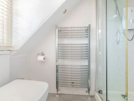 A bathroom with a towel rail and a shower at 2 Hadleigh Villas Lyme Regis