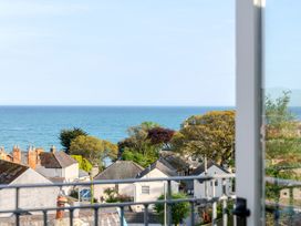 A view of the sea and houses from a balcony at 2 Hadleigh Villas Lyme Regis