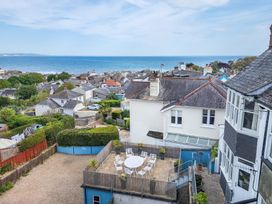 An outdoor seating area overlooking the ocean at 2 Hadleigh Villas Lyme Regis