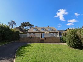 A house with steps and a front yard at Westhaven in Lyme Regis