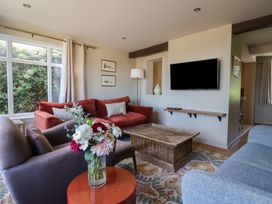 A living room with a sofa and coffee table at Westhaven in Lyme Regis