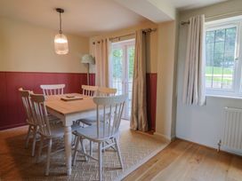 A dining room with a table and chairs at Westhaven in Lyme Regis