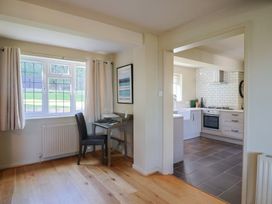 A kitchen with a view of the dining area at Westhaven in Lyme Regis