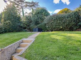 A garden with a pathway and steps at Westhaven in Lyme Regis