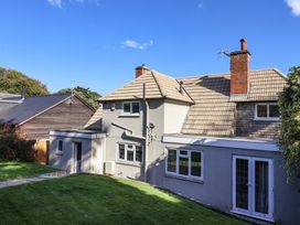 A house with windows and a chimney at Westhaven Lyme Regis