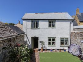 An exterior view of a house with a garden at Cleve Cottage in Lyme Regis