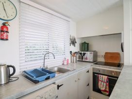 A kitchen with various appliances and utensils at 1 Wellhayes in Lyme Regis