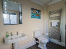 A bathroom with a sink and toilet at High Cliff Orchard in Lyme Regis