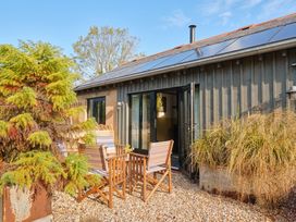 An outdoor area with chairs and plants at The Dairy Bridport