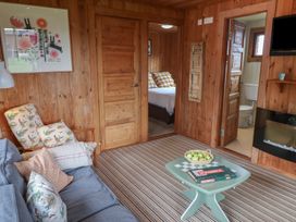 A living room with a sofa and a coffee table at 10 Pinewood Retreat in Pinewood