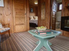 A living room with a table and chairs at 10 Pinewood Retreat in Pinewood