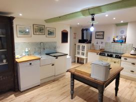 A kitchen with a sink and stove at Old Monmouth in Lyme Regis