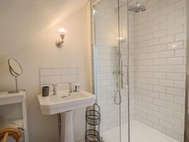 A bathroom with a shower and sink at The Little Rose in Lyme Regis