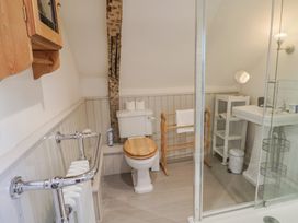 A bathroom with a toilet and sink at The Little Rose in Lyme Regis