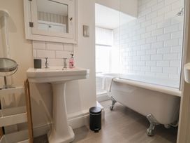 A bathroom with a sink and bathtub at The Little Rose in Lyme Regis