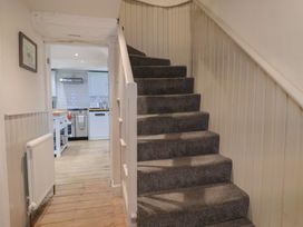 A staircase leading to an upper level at The Little Rose in Lyme Regis