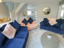 A living room with sofas and a coffee table at 11 Parc Delfryn near Benllech