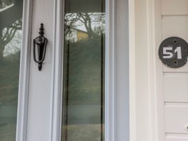 A door with a knocker and house number 51 at Green Cottage in Borth-Y-Gest