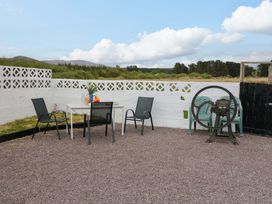 A garden area with a table and chairs at Forest View in Ballinskelligs, County Kerry