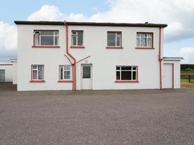 A house facade with multiple windows and a door at Forest View in Ballinskelligs, County Kerry