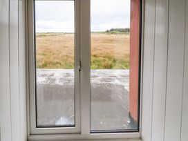 A view from a window showing grassland at Forest View, Ballinskelligs, County Kerry